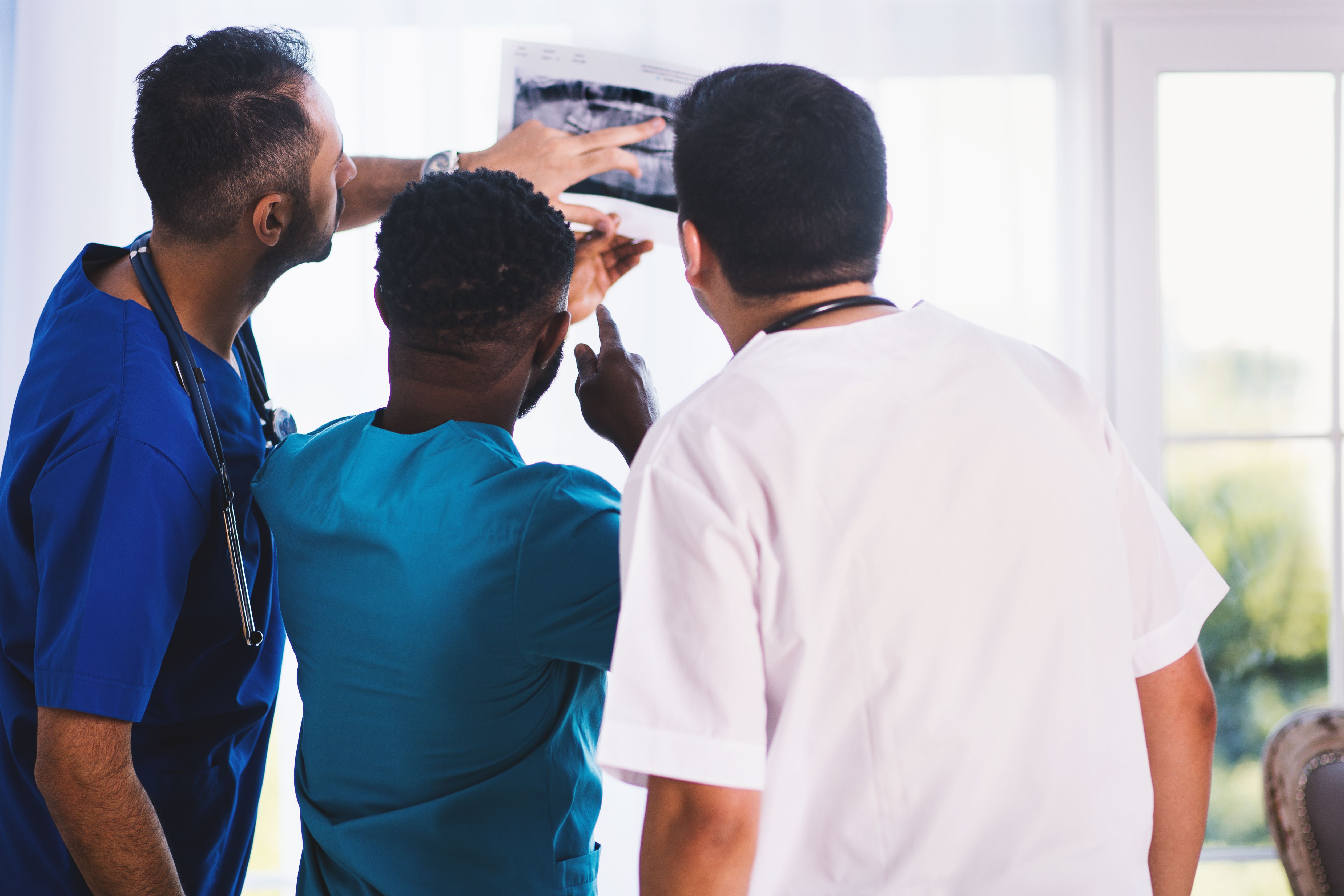 health professionals looking at an X-ray